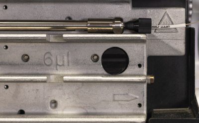 Zoomed-in picture of the Supelco® analytical HPLC column connected properly to the inlet tubing of Agilent® 1290 U/HPLC instrument. Zoomed-in picture of the Supelco® analytical HPLC column connected properly to the inlet tubing of Agilent® 1290 U/HPLC instrument.