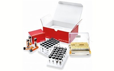 Compound Screening Library A collection of laboratory vials and a storage box. The image features a red box partially open, surrounded by several clear vials with black caps, a tray of vials, and a separate container holding multiple vials in a grid pattern. The items are arranged on a white background.