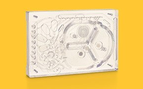The 2 mL microbioreactor cassette integrates automated pumps, valves, optical sensors, and a cell retention filter.