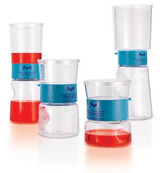 A group of six laboratory beakers and flasks, each equipped with blue silicone tops, containing varying levels of red and clear liquids. These containers are arranged in a somewhat staggered composition to display their different shapes and sizes, set against a light background.