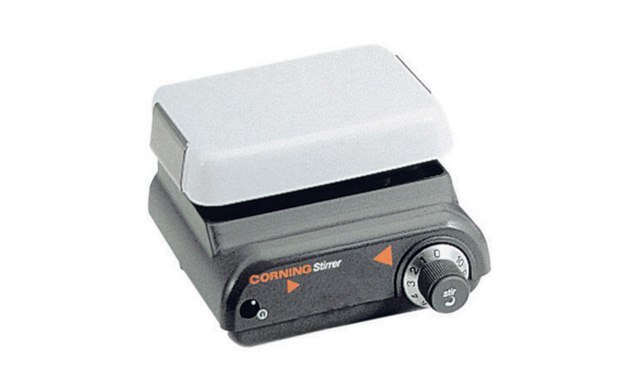A Corning plate stirrer with a white top and a black base featuring control dials. The device is designed for laboratory use to stir liquids, ensuring consistent mixing for scientific experiments. A Corning plate stirrer with a white top and a black base featuring control dials. The device is designed for laboratory use to stir liquids, ensuring consistent mixing for scientific experiments.