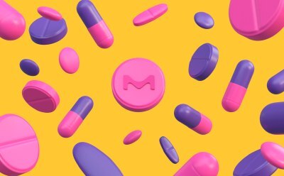 Various pink and purple pills and capsules scattered on a bright yellow background. One prominent round pink pill in the middle of the picture features the letter "M" embossed on it. Various pink and purple pills and capsules scattered on a bright yellow background. One prominent round pink pill in the middle of the picture features the letter "M" embossed on it.