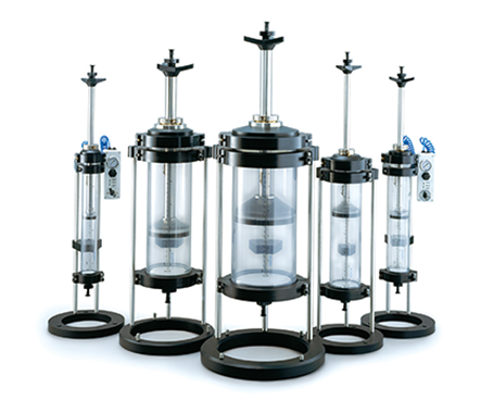 Vantage® columns A set of five chromatography columns with varying heights, each featuring a clear middle section, black bases and tops, and some with blue valves.