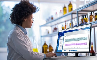 Automated control and monitoring of remote unit operations with advanced control software Female scientist in lab coat using laptop using control software to automate, monitor, and control a bioprocess unit operation