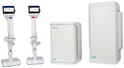 Two medical devices on stands with screens, one red and one blue, alongside a compact white unit and a larger white box. All devices feature the M logo. Two medical devices on stands with screens, one red and one blue, alongside a compact white unit and a larger white box. All devices feature the M logo.